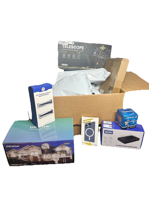 Collection of boxes with various products including a telescope and electronic devices on a white background